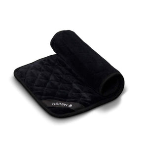 Black quilted MiHIGH towel folded on a white background