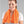 Woman wearing an orange Miracool cooling towel around her neck