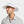 Man wearing a white Mission wide brim sun hat with a chin strap