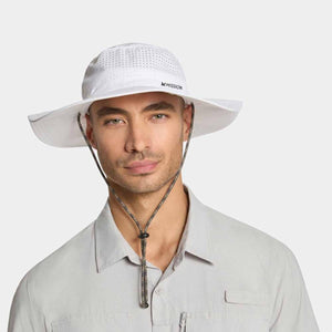 Man wearing a white Mission wide brim sun hat with a chin strap