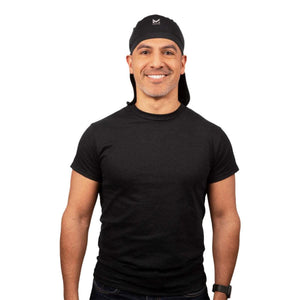 Man wearing a black Mission cooling skull cap