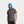 Man wearing a grey Mission t-shirt with a blue cooling hood pulled up