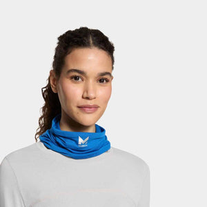 Woman wearing a blue Mission cooling neck gaiter