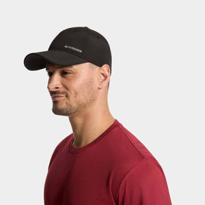 Man wearing a black Mission baseball cap