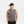 Man wearing a grey Mission sleeveless shirt and a black Mission visor