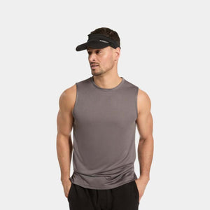 Man wearing a grey Mission sleeveless shirt and a black Mission visor
