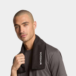 Man wearing a black Mission cooling towel around his neck