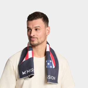 Man wearing a Mission cooling towel with a red white and blue flag pattern