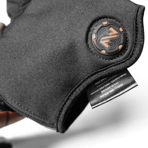 Mobile Warming glove cuff showing material composition label and circular logo