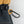 Mobile Warming glove detail showing black carabiner attached to tan leather eyelet