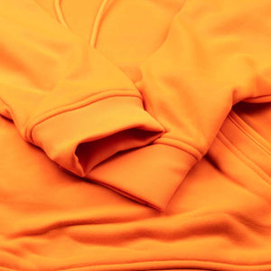 Close up of orange Mobile Warming hoodie sleeve cuff