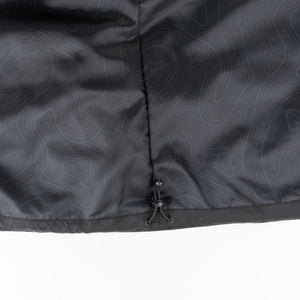 Mobile Warming jacket interior lining with topographic pattern and adjustable drawstring hem