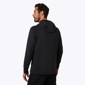 Man wearing a black Mobile Warming hooded long sleeve shirt viewed from the back