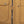 Mobile Warming jacket detail showing brown canvas fabric with zipper and snap button closures