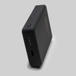Mobile Warming black rectangular portable power bank with four LED battery indicator lights