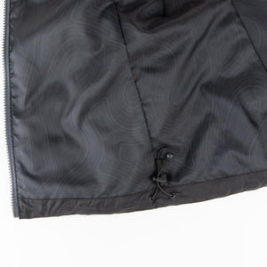 Interior lining of a Mobile Warming jacket with topographic print and adjustable drawstring hem