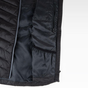 Interior view of a Mobile Warming black quilted vest showing the lining and zippered pocket