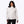 Woman wearing a white Mobile Warming patterned jacket with black pants