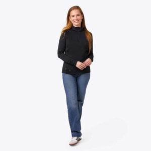 Woman wearing a black Mobile Warming long sleeve quarter zip shirt and blue jeans