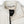 Cream colored Mobile Warming fleece jacket collar with interior brand label and zipper