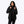 Woman wearing a black Mobile Warming hooded jacket with a quilted inner layer