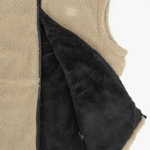Mobile Warming tan fleece vest with black interior lining and zipper detail