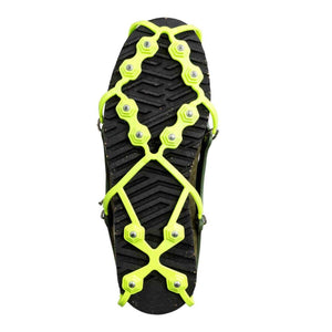 Snowline traction spikes attached to the sole of a boot