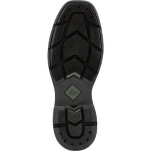 Black rubber outsole of a Muck boot with textured tread pattern and brand logo