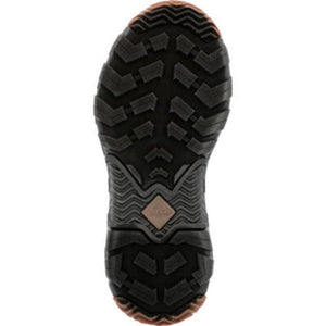 Black rubber lugged outsole of a Muck boot