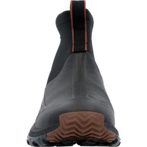 Rear view of black Muck ankle boot with brown pull tab and brown rubber tread