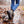 Person wearing Muck camo ankle boots walking through a shallow puddle with fallen leaves