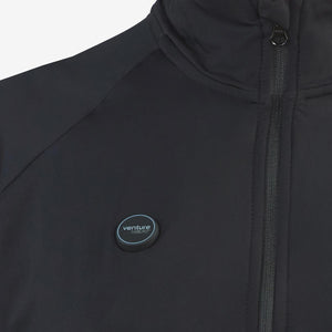 Close up of Venture Heat black heated jacket with power button