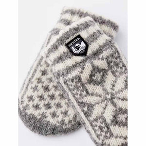 Hestra grey and white patterned wool mittens with brand logo patch