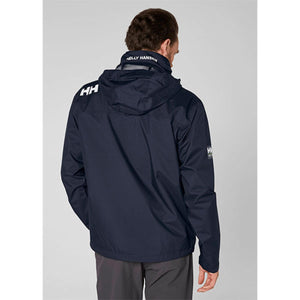Back view of a person wearing a navy Helly Hansen hooded rain jacket