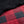 Red and black buffalo plaid quilted fabric with black sherpa lining