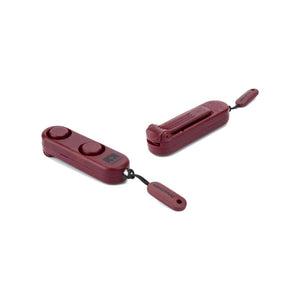 Two maroon Nathan personal safety alarms with lanyards