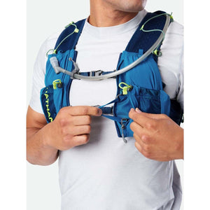 Person wearing a blue Nathan hydration vest with chest straps and hydration tube