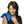 Woman using a blue Nature Creation heat pack on her shoulder