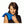 Woman using a blue Nature Creation heating pad on her shoulder
