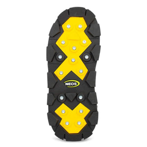 Neos boot sole with yellow traction pads and metal spikes