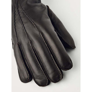 Hestra brown leather glove with decorative stitching on the back