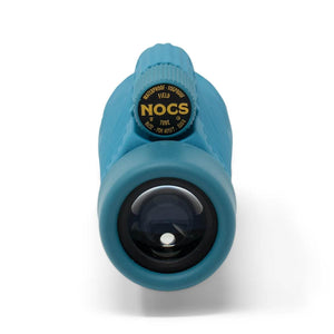 Blue NOCS Provisions Field Tube monocular viewed from the front lens
