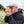 Person using a yellow NOCS Provisions monocular in a field