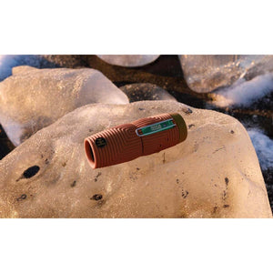 NOCS Provisions monocular resting on a block of ice