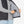 Person placing a Venture Heat battery pack into the interior pocket of a black heated vest