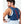 Man wearing a blue Nathan hydration vest with white pattern