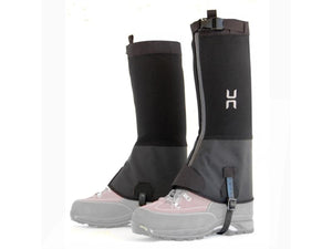 Pair of black hiking gaiters worn over grey hiking boots
