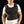 Man wearing a black Miracool cooling vest over a white t-shirt