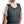 Man wearing a dark grey Miracool cooling vest over a white t-shirt