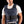 Man wearing a navy blue Miracool cooling vest over a white t-shirt